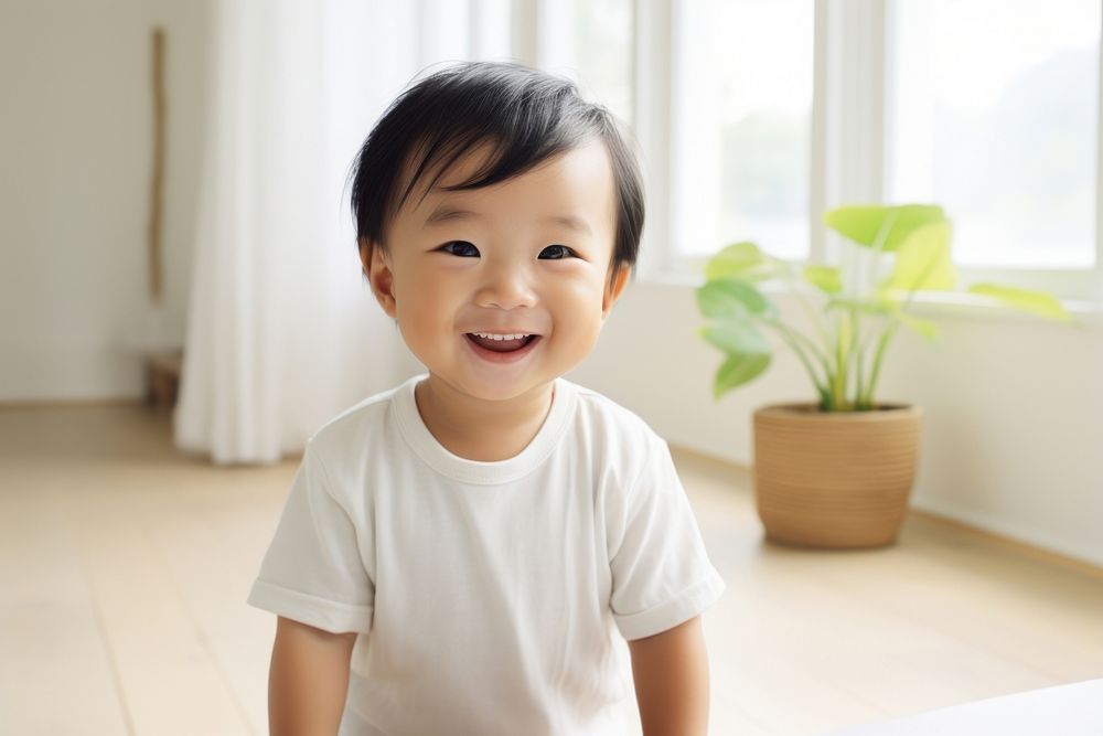A happy asian toddler at home smile baby happiness.