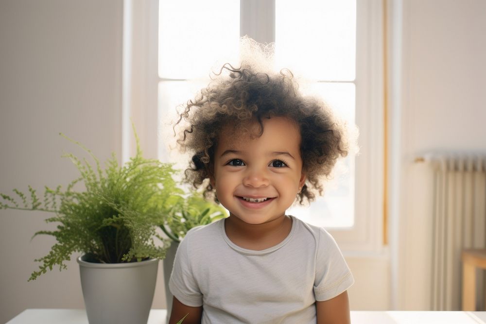 A happy multiracial toddler at home portrait child smile.