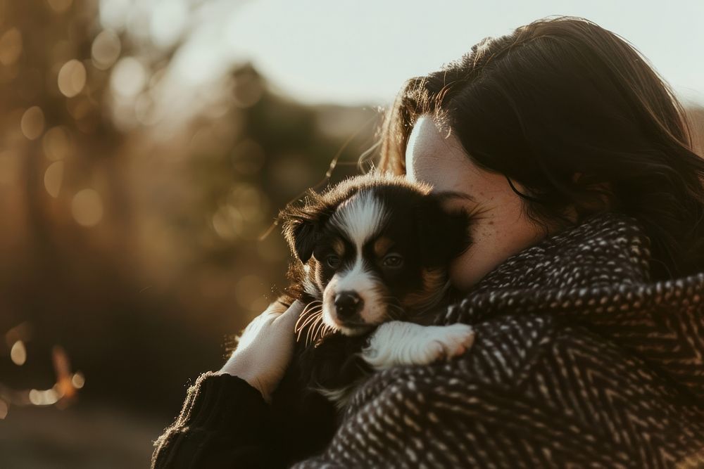 Woman holding a puppy photography portrait mammal.