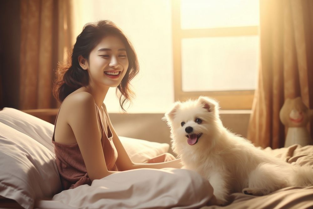 Asian woman playing in bed with dog person female animal.