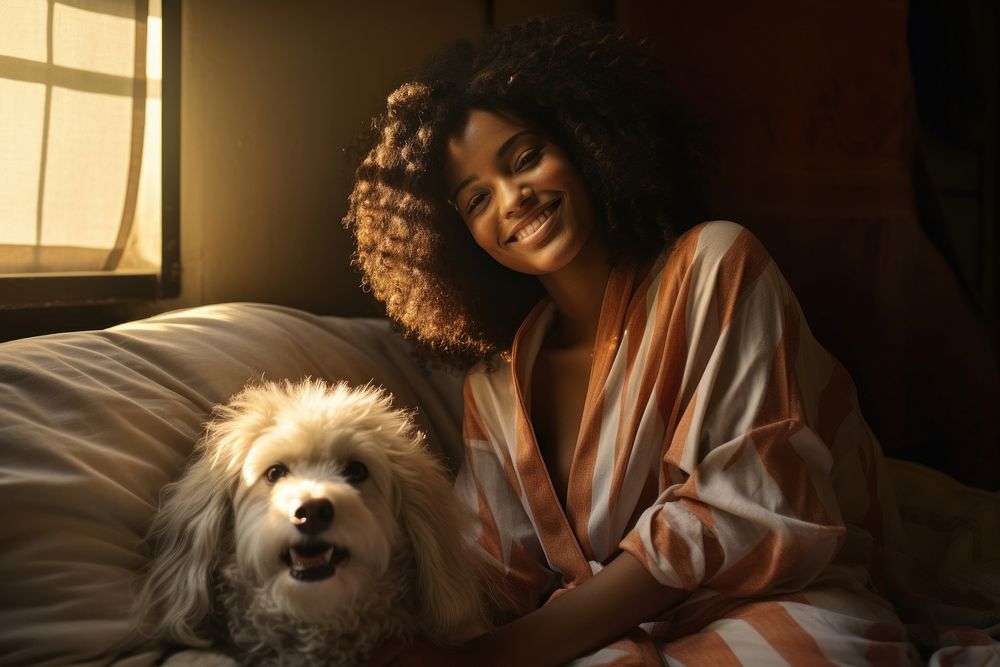 Black woman lounging in bed with dog photo photography portrait.