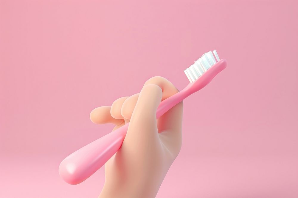 Hand holding toothbrush device tool.