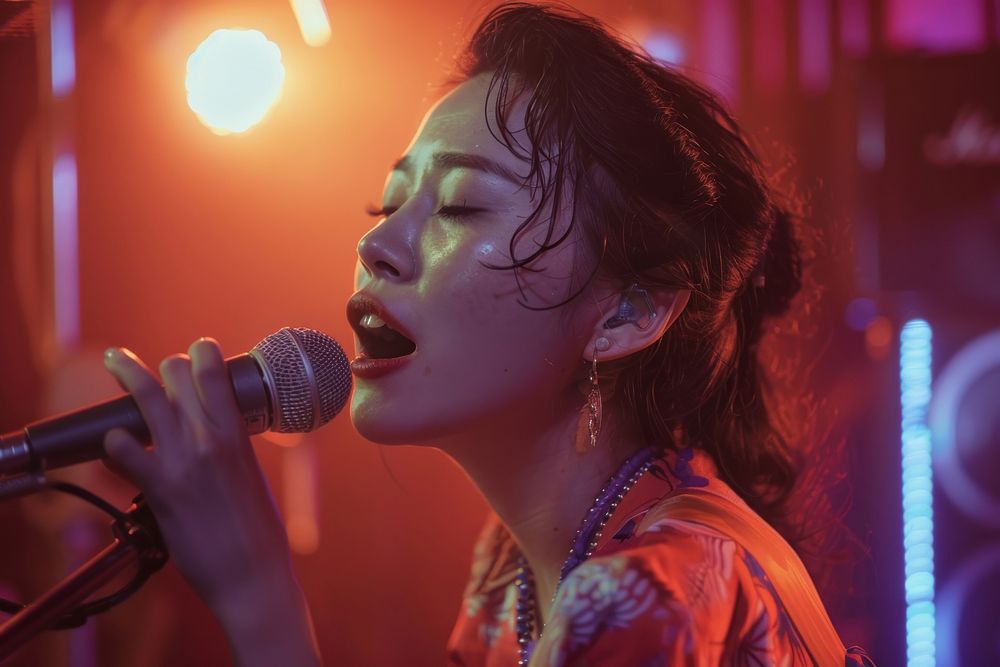 Thai woman singing music at karaoke room accessories microphone performer.