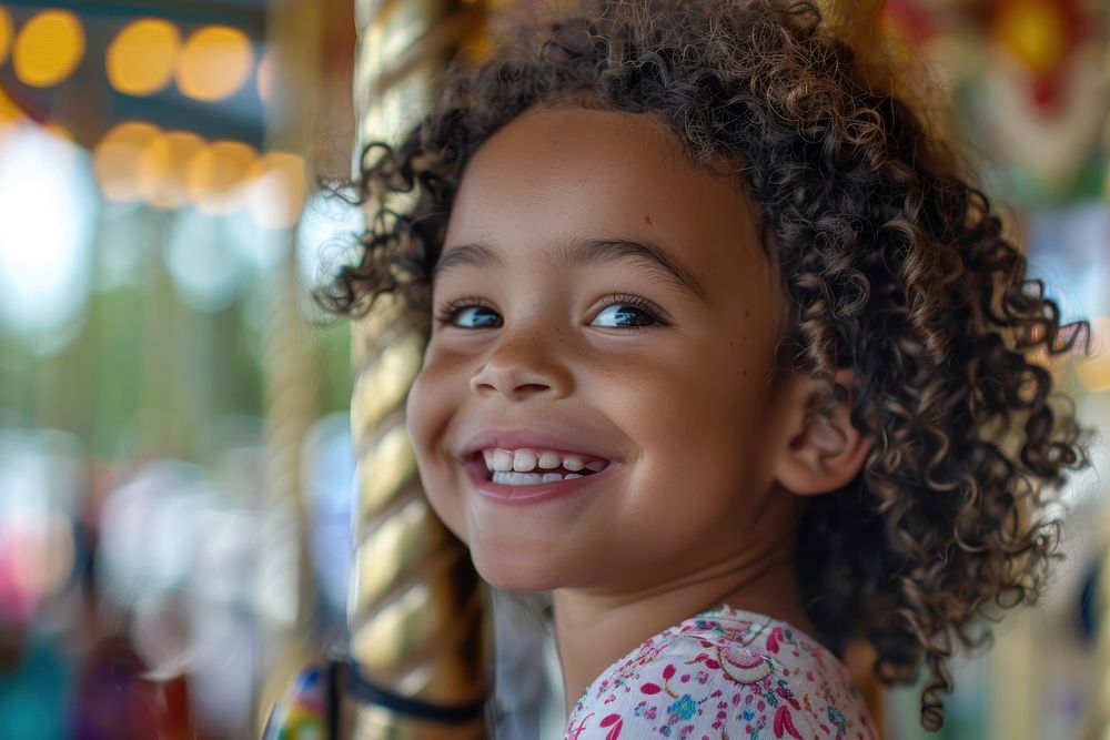A mixed race child with curly hair smiles photography portrait person.