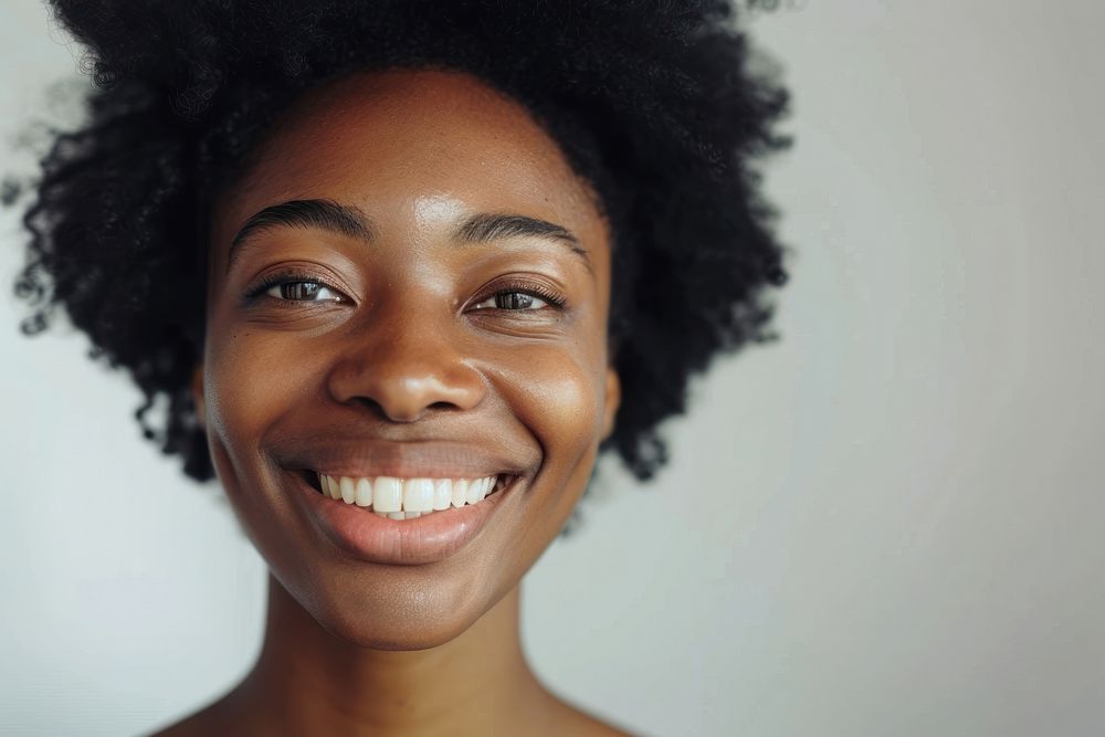 Beautiful black woman smiling with white teeth face skin dimples.