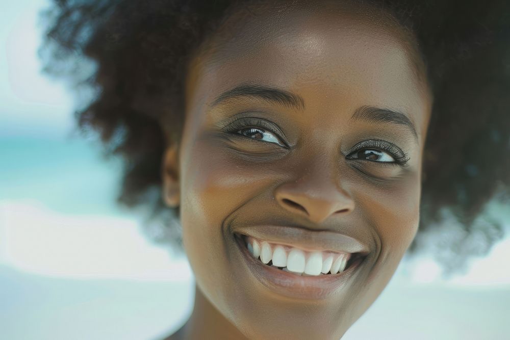 Beautiful black woman smiling with white teeth face skin dimples.