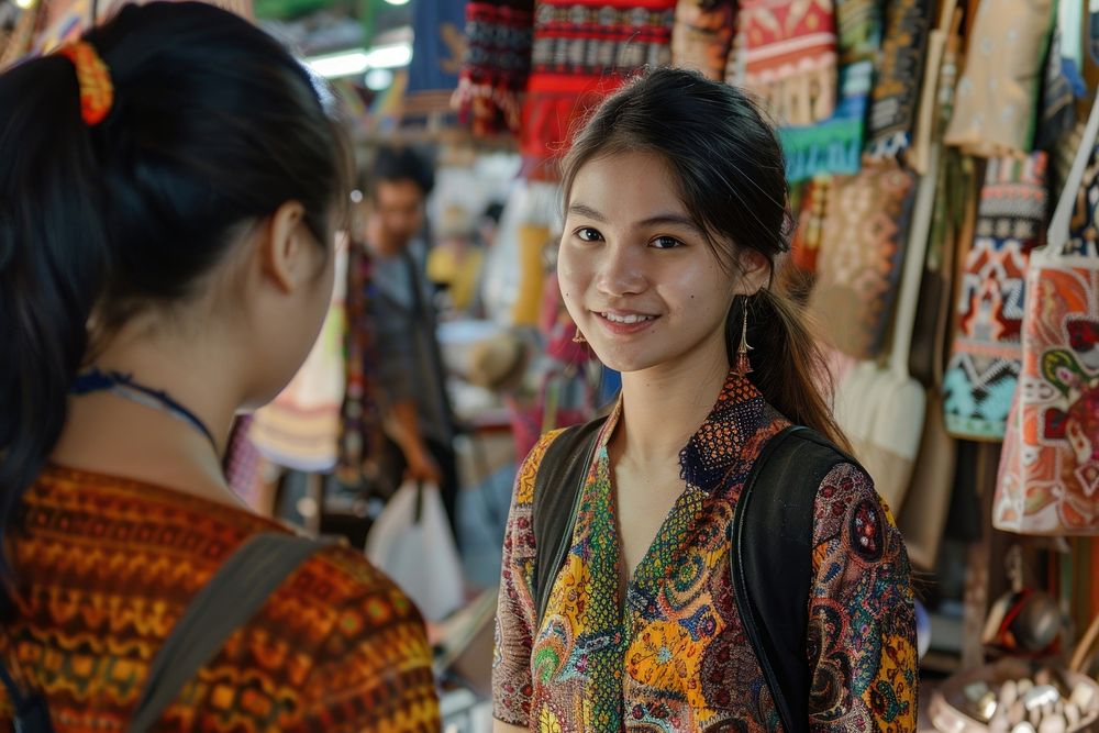 Thai young woman merchant wearing 1980s clothing style talking with customer market accessories accessory.