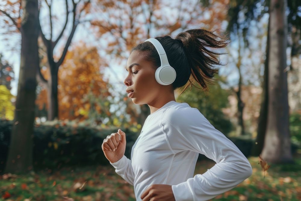 Young woman running electronics headphones headset.