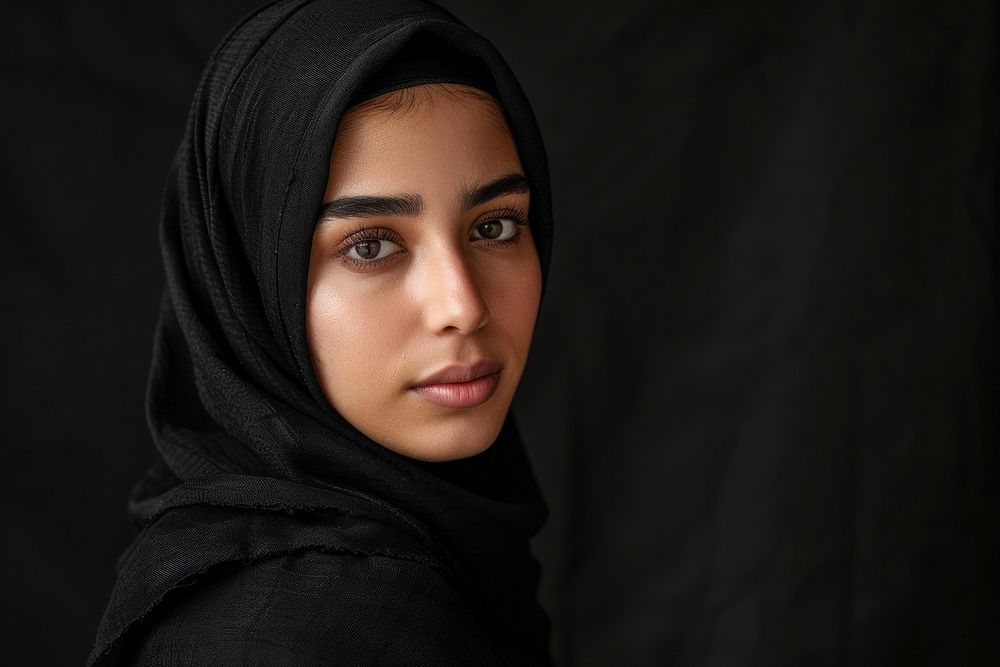 Muslim woman wearing the black hijab photo photography portrait.
