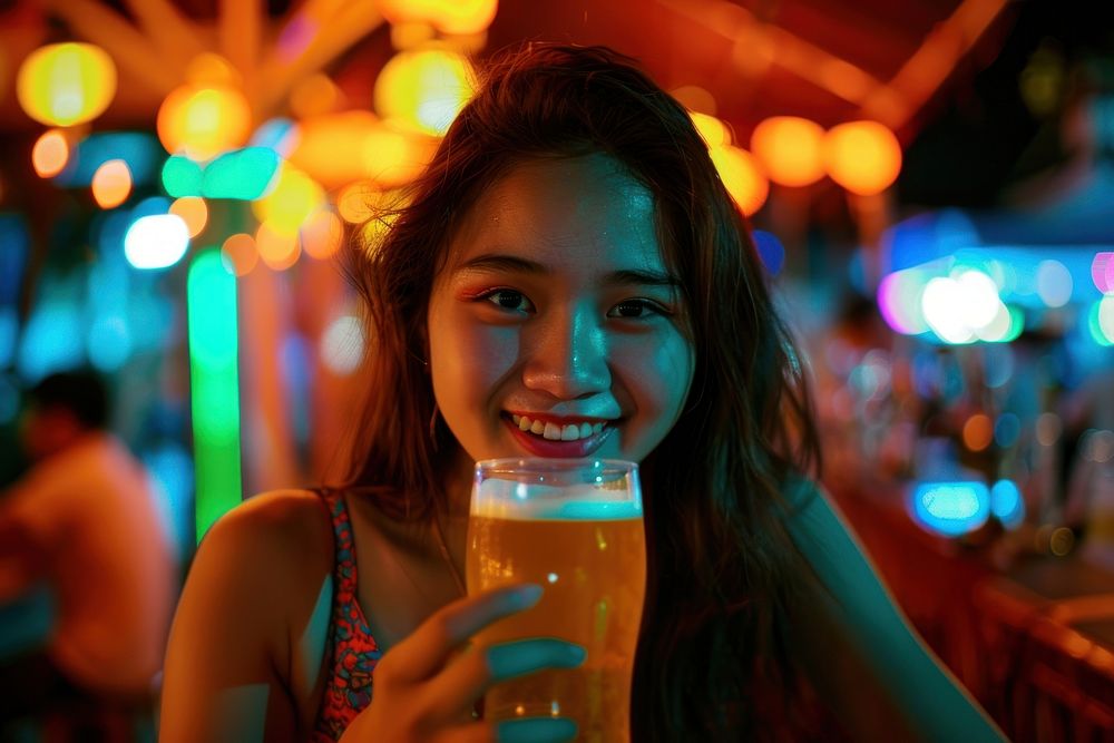 Thai young woman drinking photo beer.