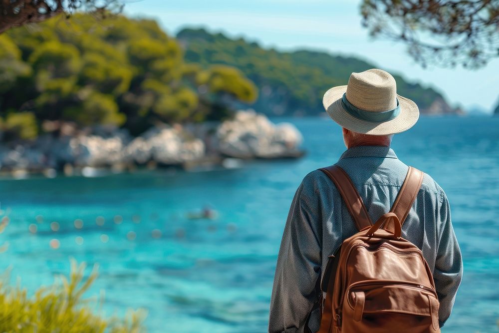Senior traveler stand backpack adult sea.