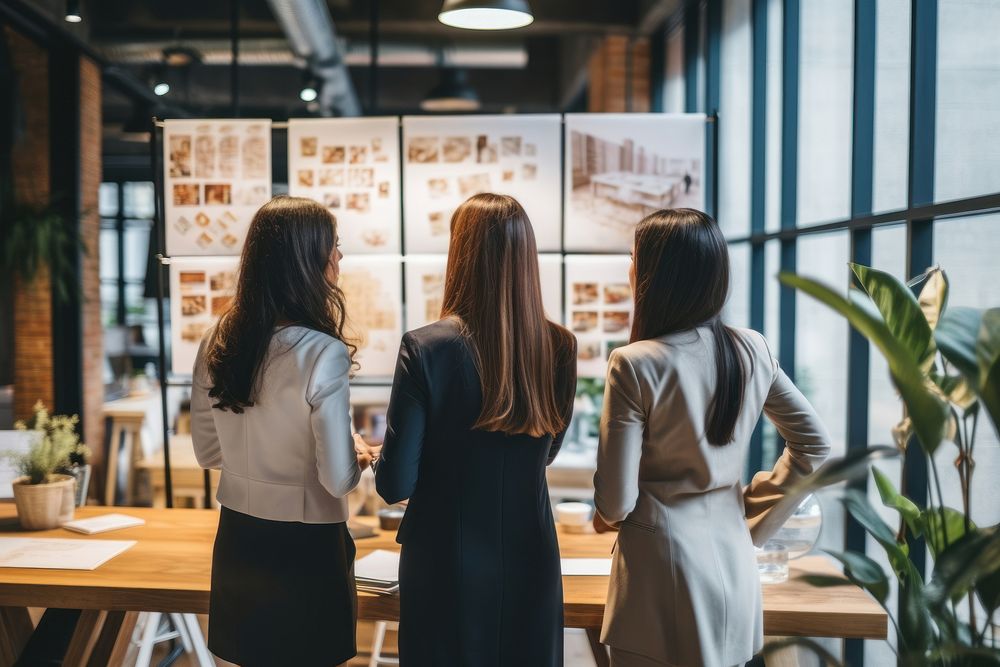 Women standing together planning business conversation female person.