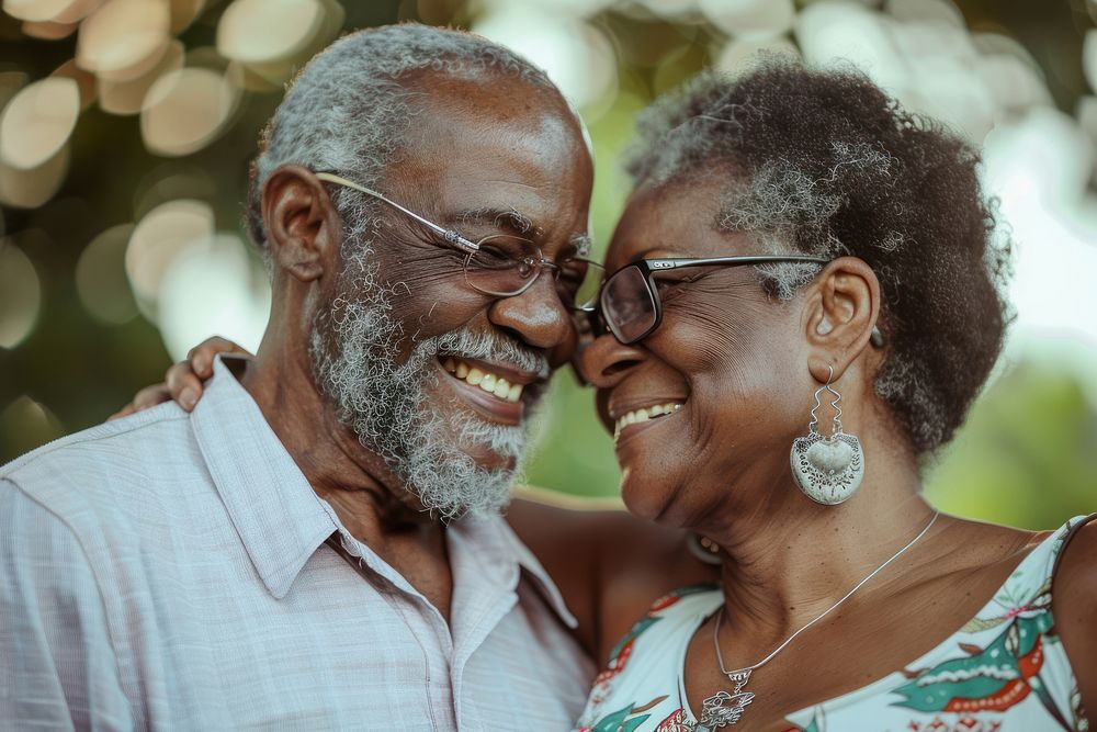 Happy black senior couple portrait glasses jewelry.