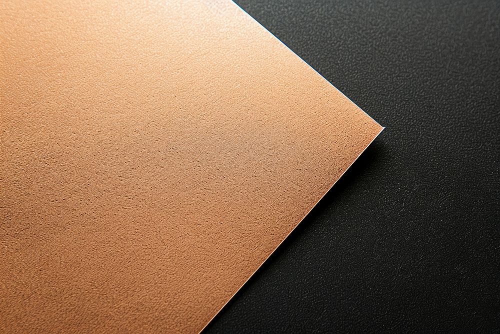 Rose gold hard paper mockup indoors plywood texture.