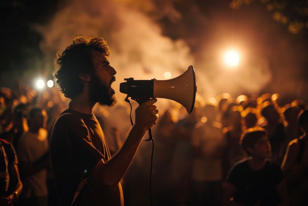 White man using megaphone people photo crowd.