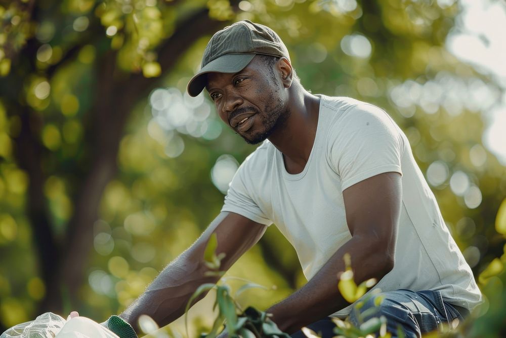 African american man volunteering gardening outdoors clothing.