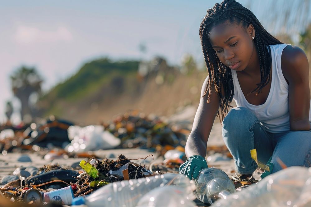 African american teenager volunteering garbage clothing apparel.