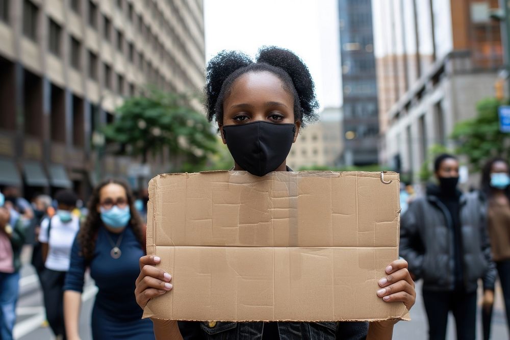 Black woman wear black cardboard electronics hardware.