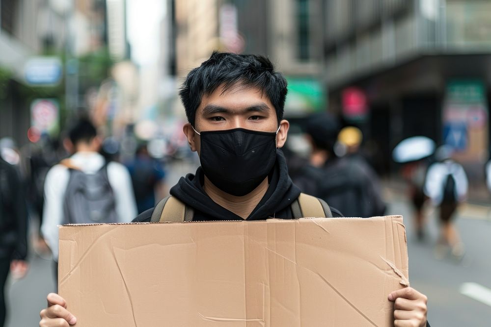 South east asian man wear black cardboard backpack female.
