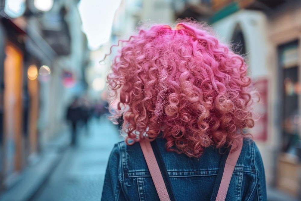 Woman pink curls hairstyles street architecture portrait.