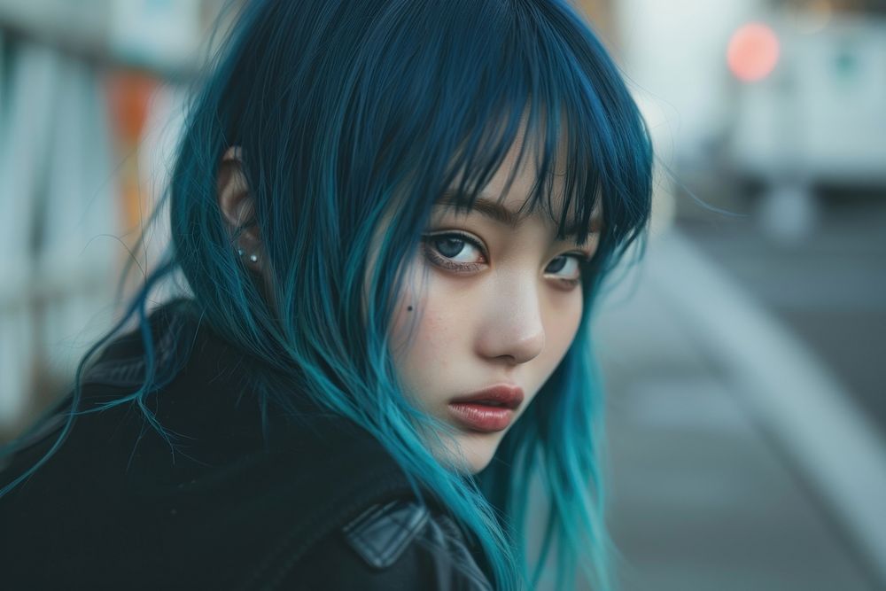 Asian woman blue full bangs hairstyles adult individuality portrait.
