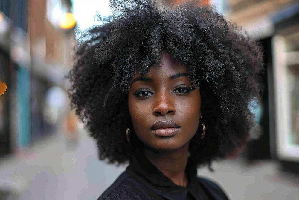 Black woman voluminous layers hairstyles portrait photo individuality.