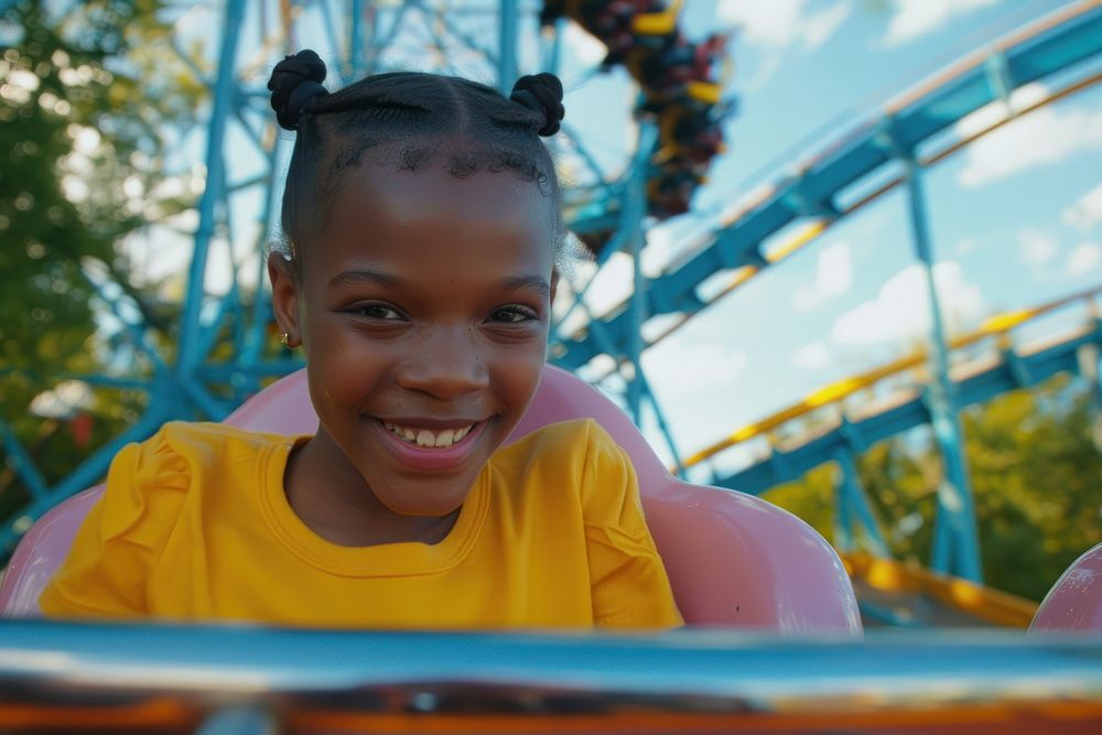 A young black girl on roller coaster portrait child photo.