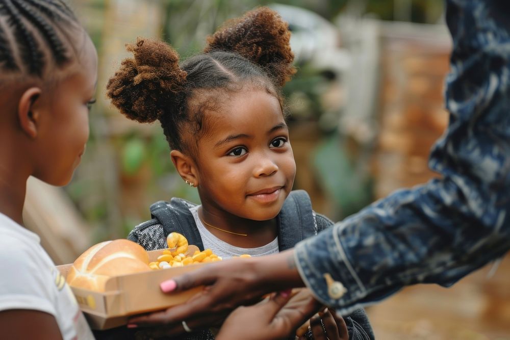 Black girl receive food from volunteer medication person female.
