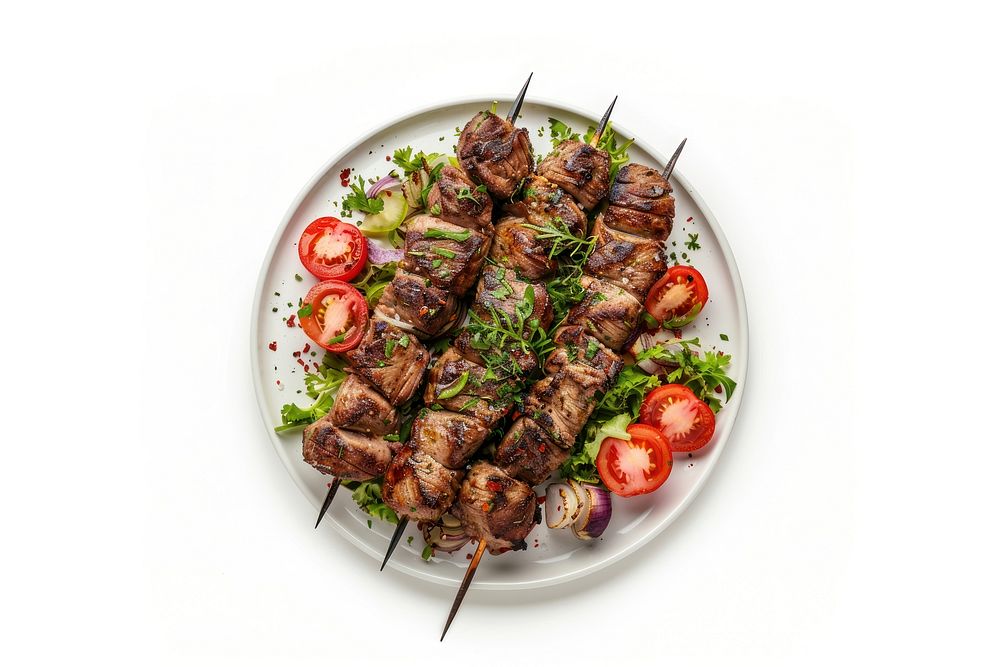Photo of kebab dish grilling meat.