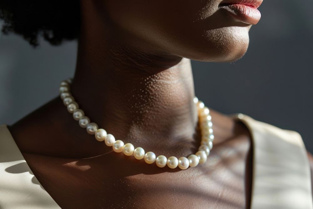 Photo of pearl necklace jewelry accessories midsection.