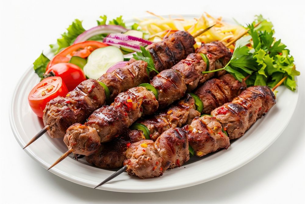 Photo of kebab dish grilling meat.