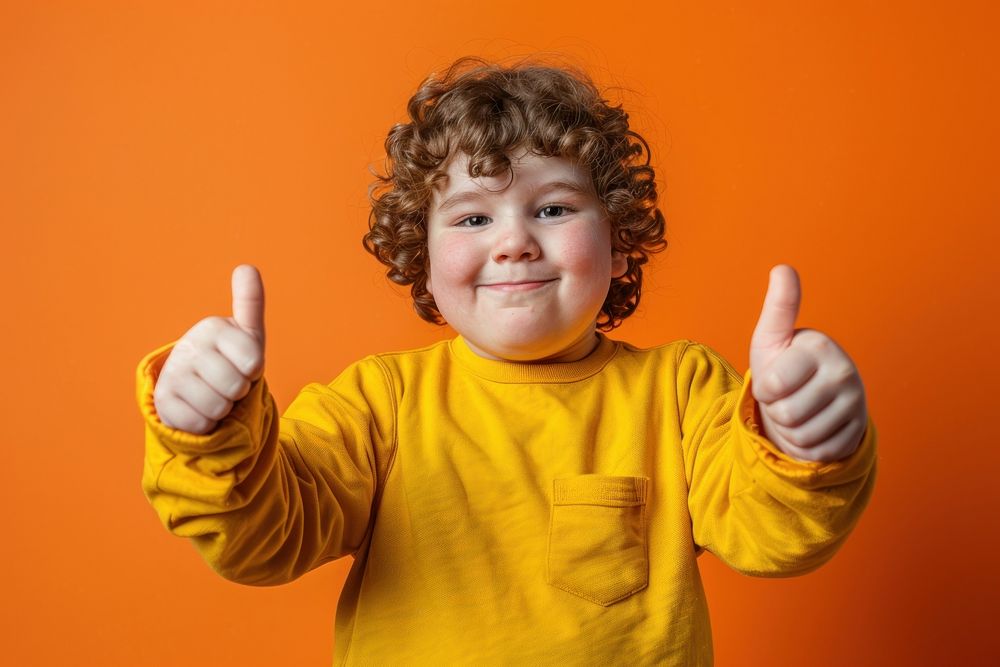 Chubby kid thumbs up portrait baby photography.