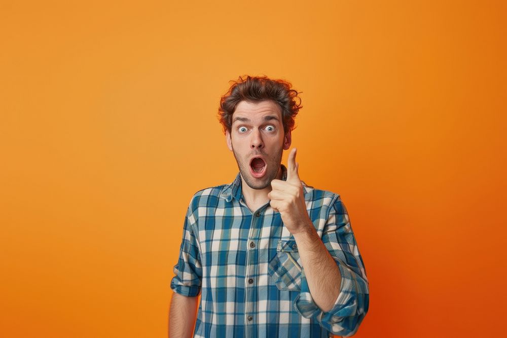 Photo of a man pointing finger face surprised clothing.