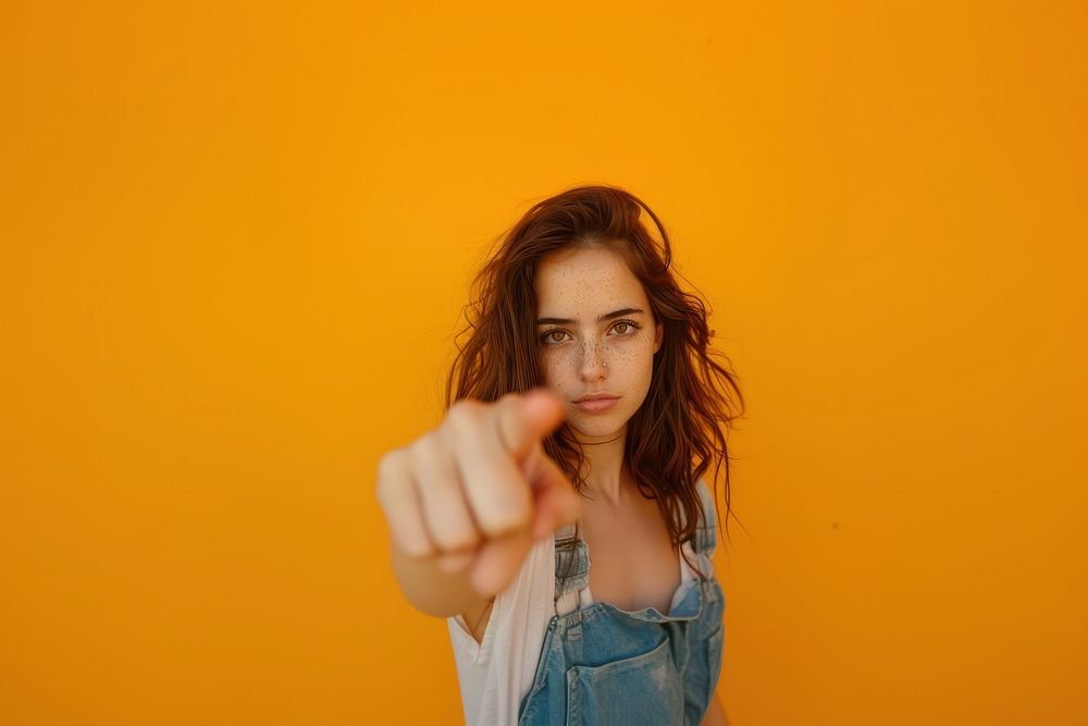 Photo of aggresive female pointing a finger portrait photography accessories.
