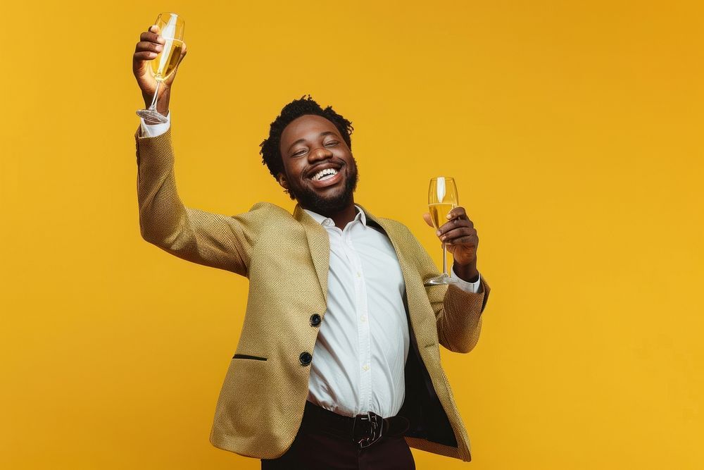 Photo of business man raising a champagne glass triumphant cosmetics laughing.