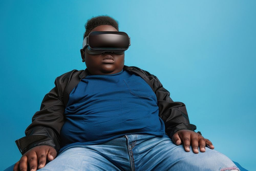 Boy wearing VR glasses portrait sitting accessories.