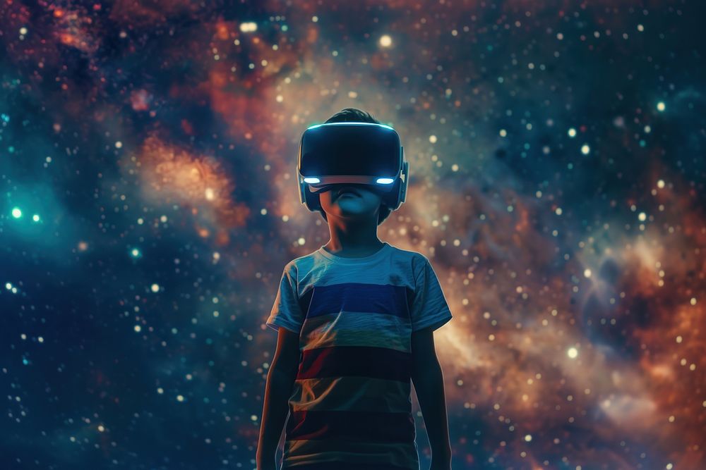 Boy wearing VR glasses outdoors nature helmet.