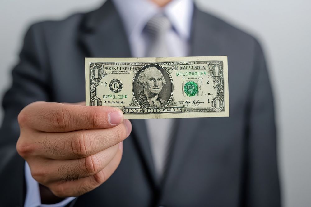 A business man holding dollar money paper adult.