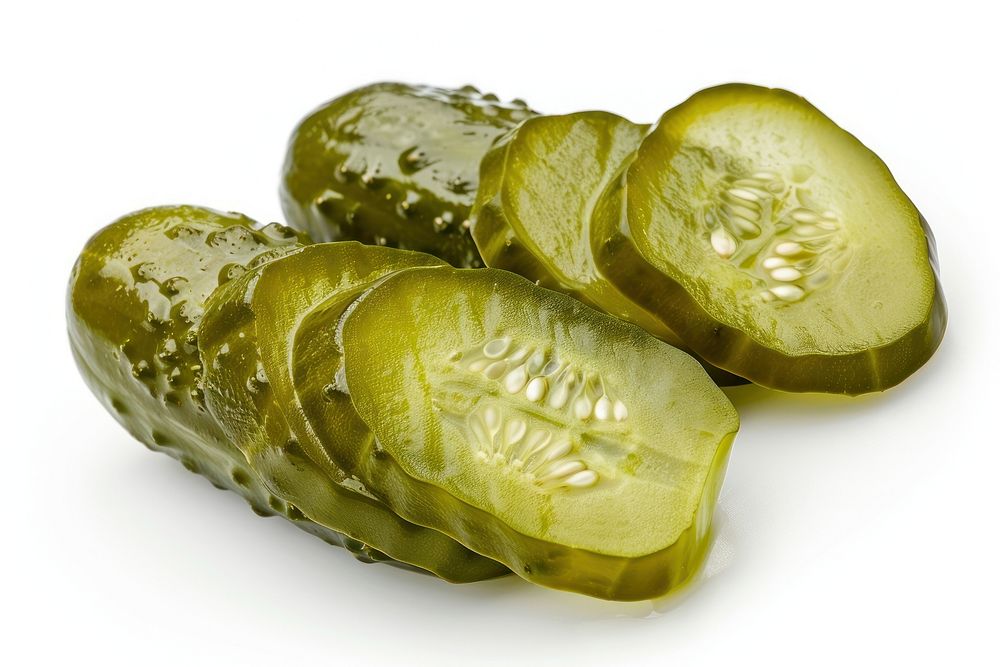 Horizontal slices of pickled gherkin plant food white background.
