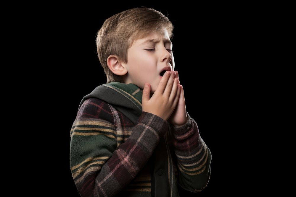 Boy coughing child spirituality portrait.