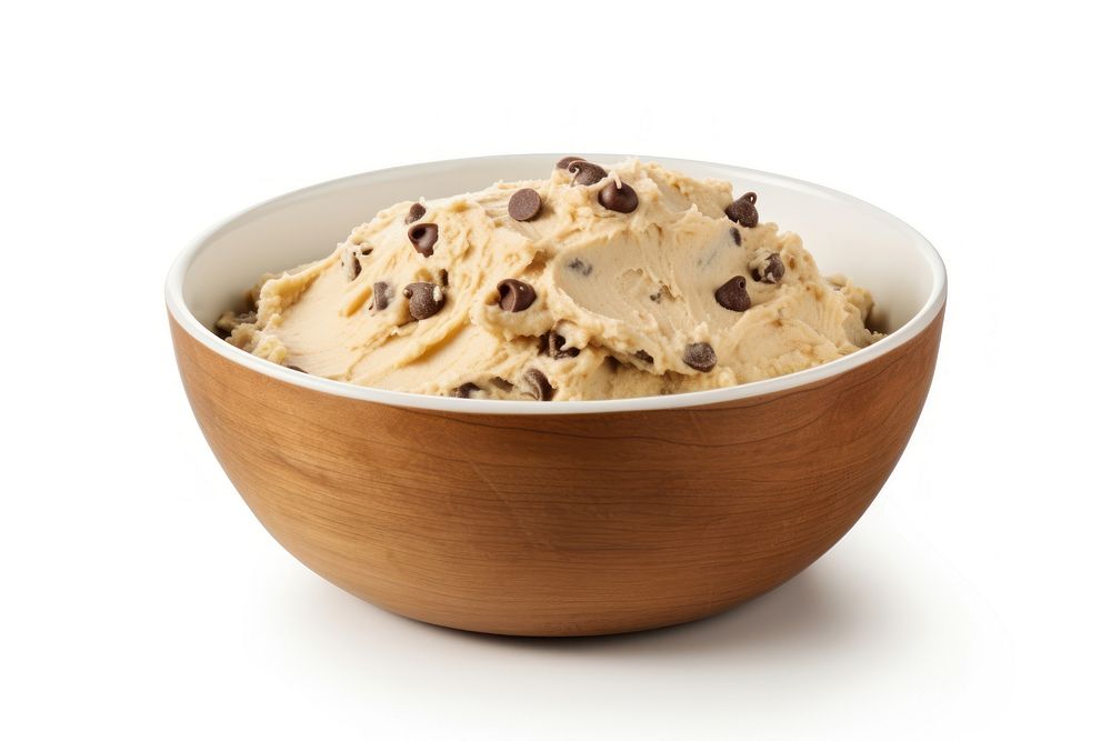 Chocolate chip cookie dough in a mixing bowl dessert food white background.