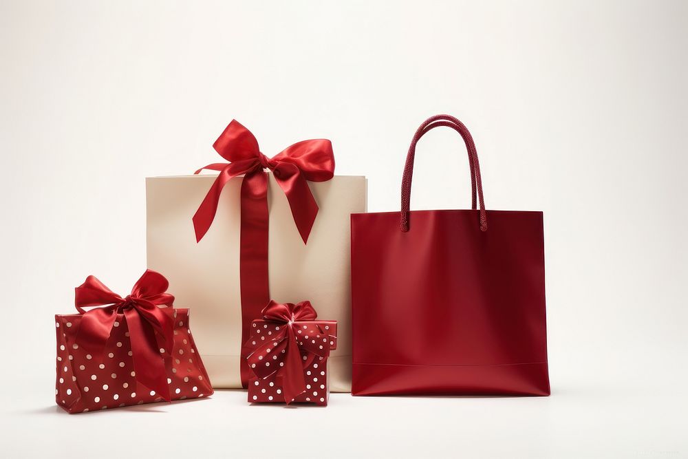 Presents in festive shopping bag handbag white background celebration.