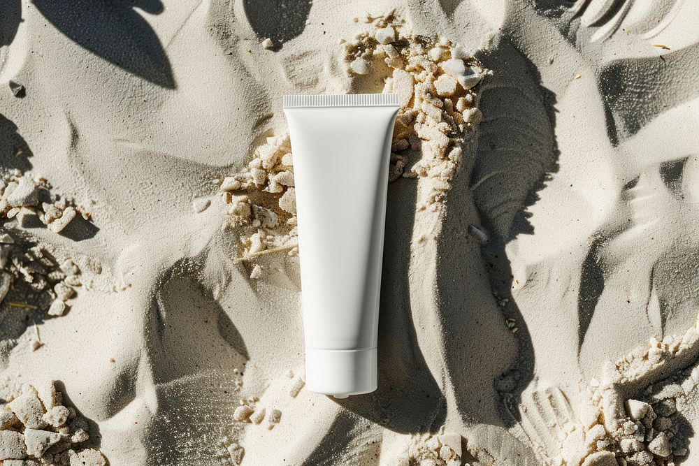 Sunscreen tube mockup outdoors beach cosmetics.