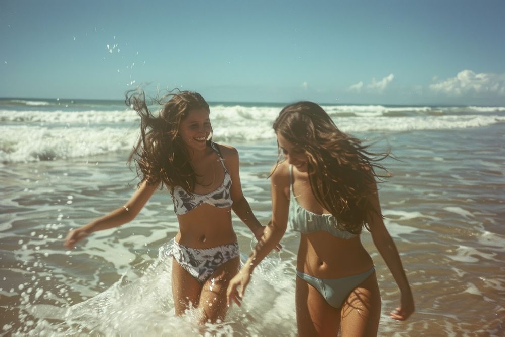 Women playing on the beach summer photography swimwear.