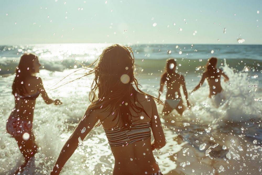 Women playing on the beach summer swimwear vacation.
