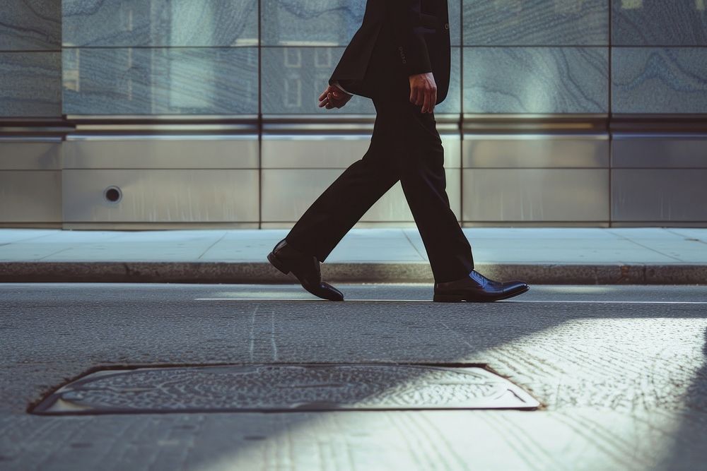 Business man walking on the street pedestrian clothing footwear.