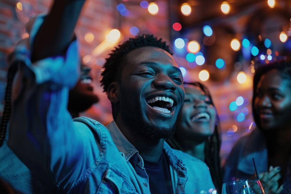 Cheerful black man celebrating party cheerful laughing.