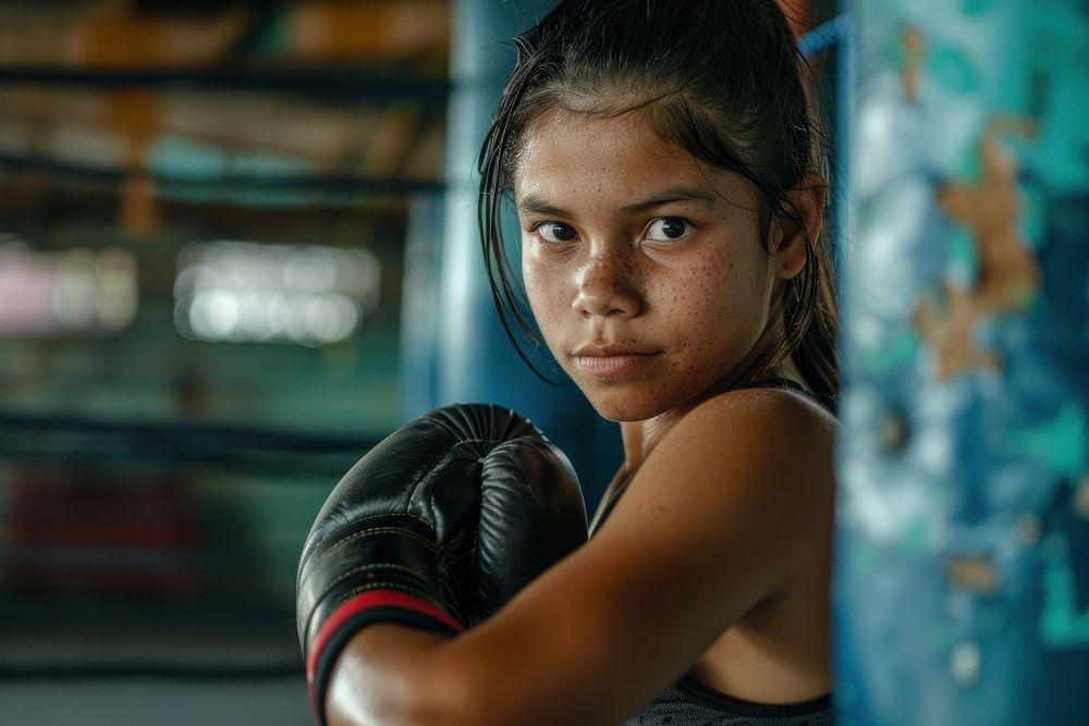 Girl exercising in boxing determination concentration contemplation.