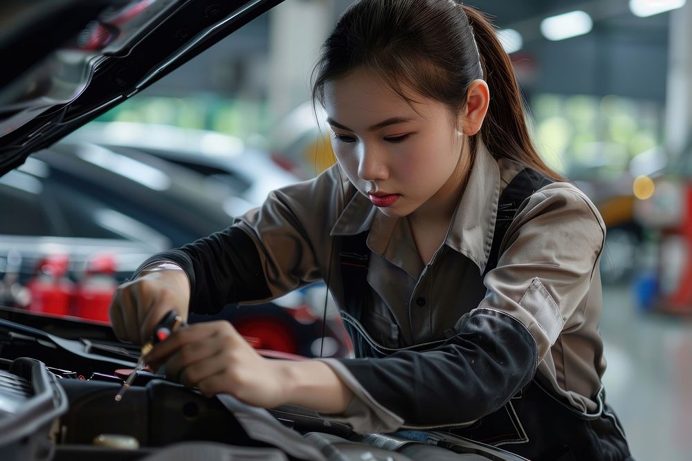 Maintenance female checking vehicle driving transportation.