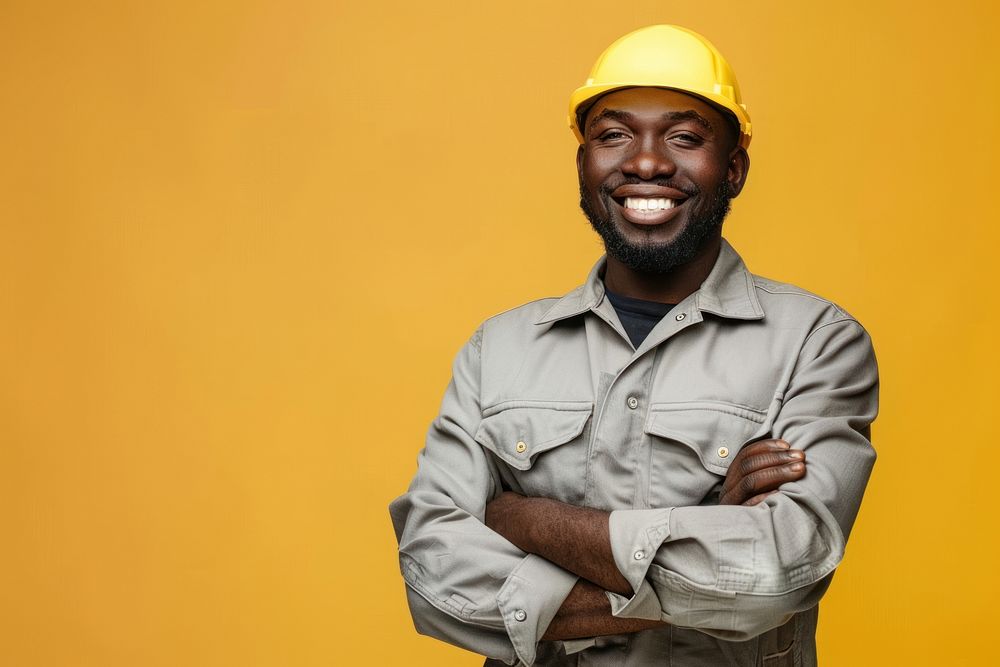 Joyful male african american builder hardhat helmet yellow.